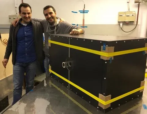 A full carbon-composite box prototype to host the new LHCb Upstream Tracker detector